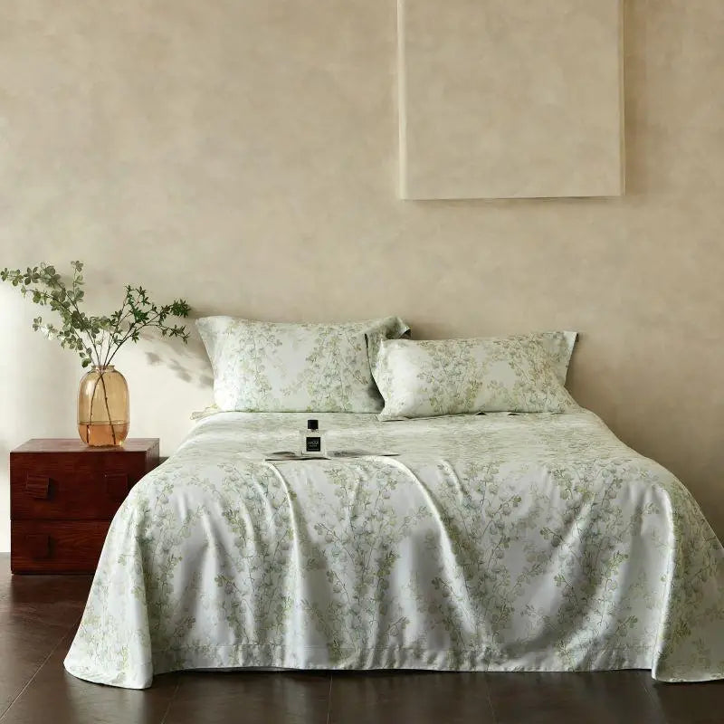 Bedroom with floral bedding and a wooden nightstand.