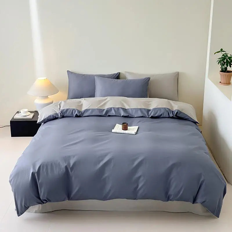 Bed with blue bedding in a minimalistic room