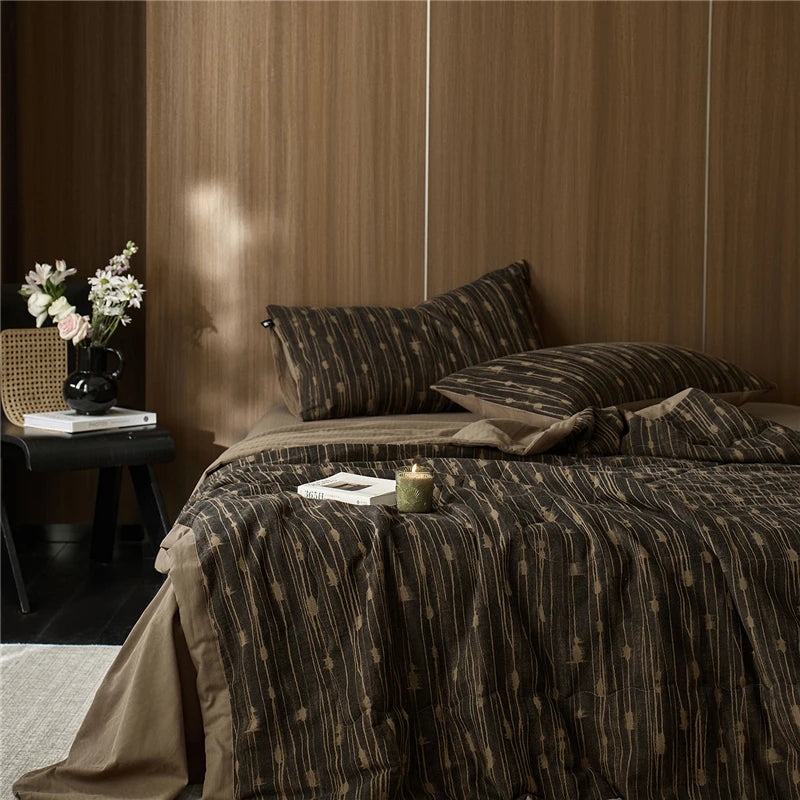 Beige and brown quilted blanket at the happy ladies