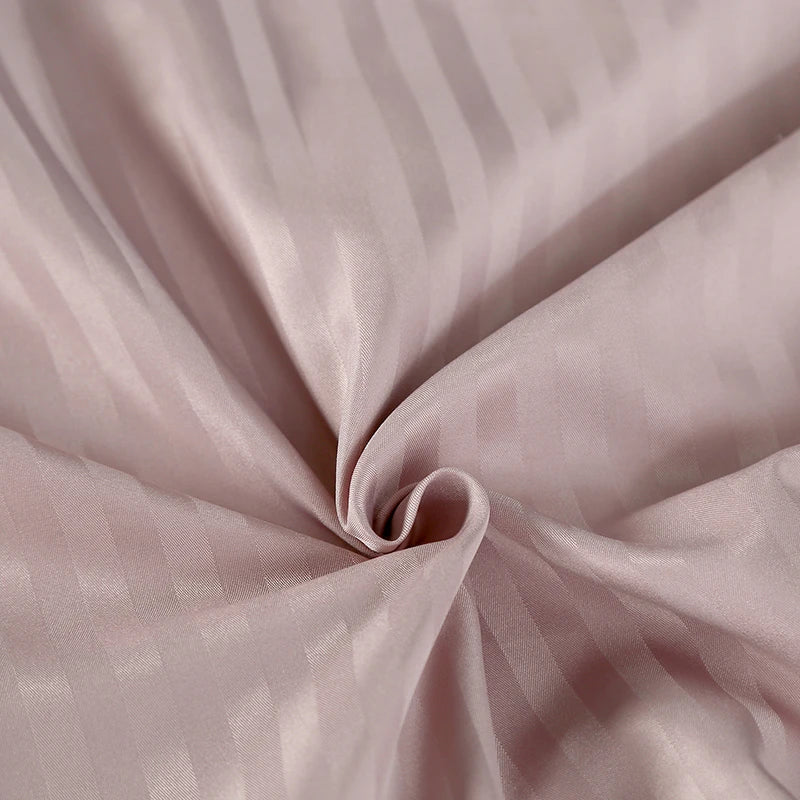 Close-up of 400TC pink satin flat or fitted sheet duvet cover set with pillowcases