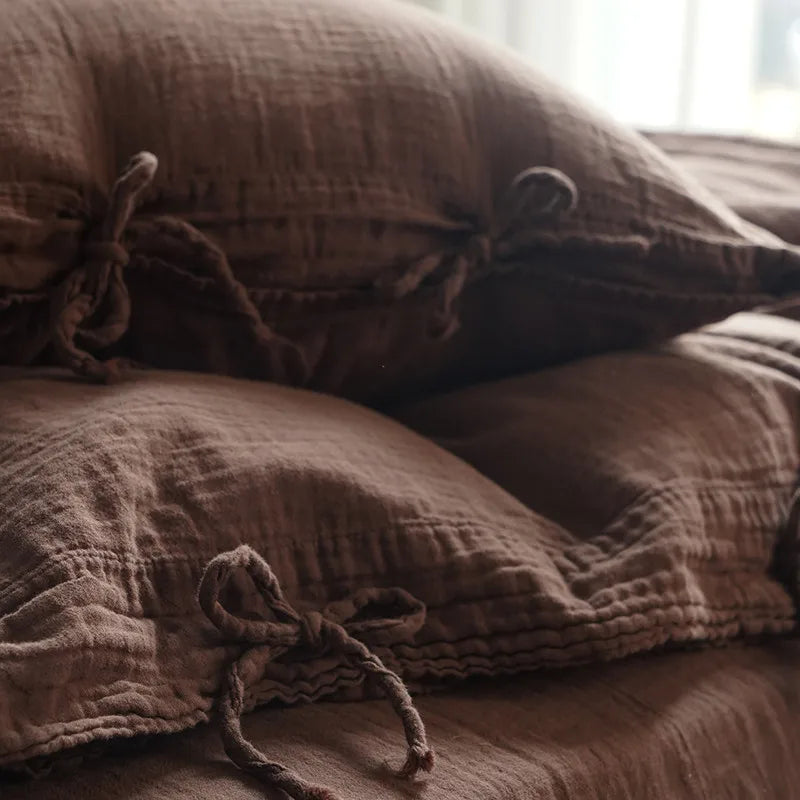 Close up of Chocolate Brown 600TC Cotton Twill Wrinkled Yarn Bedding Set pillowcases with bow tie