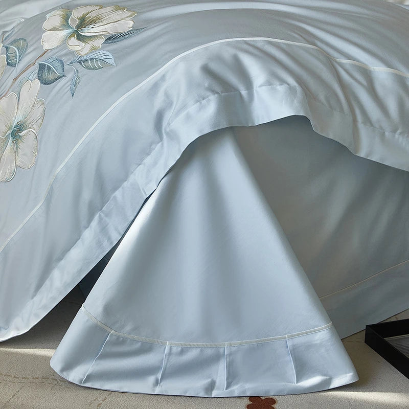 Close up of Sky Blue Floral Embroidery 600TC Cotton flat bed sheet with duvet cover and pillowcases