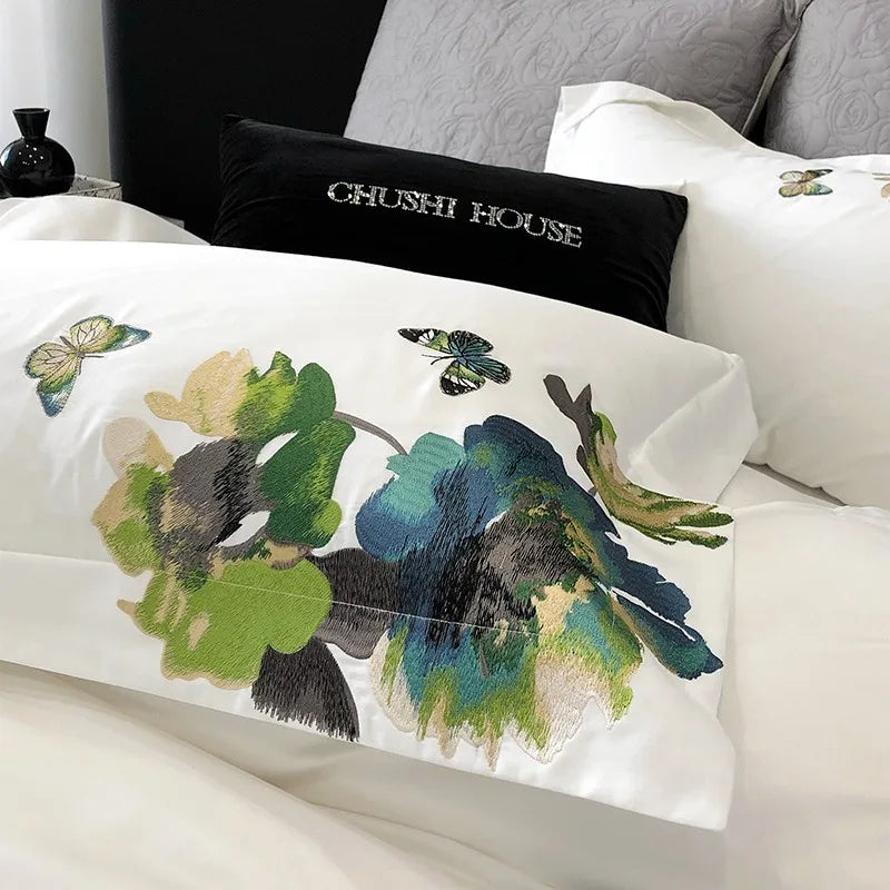 Decorative pillow with butterfly design on a bed