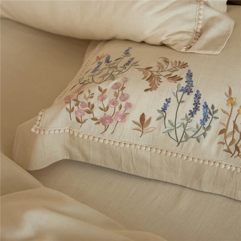 Decorative pillow with floral embroidery on a beige background