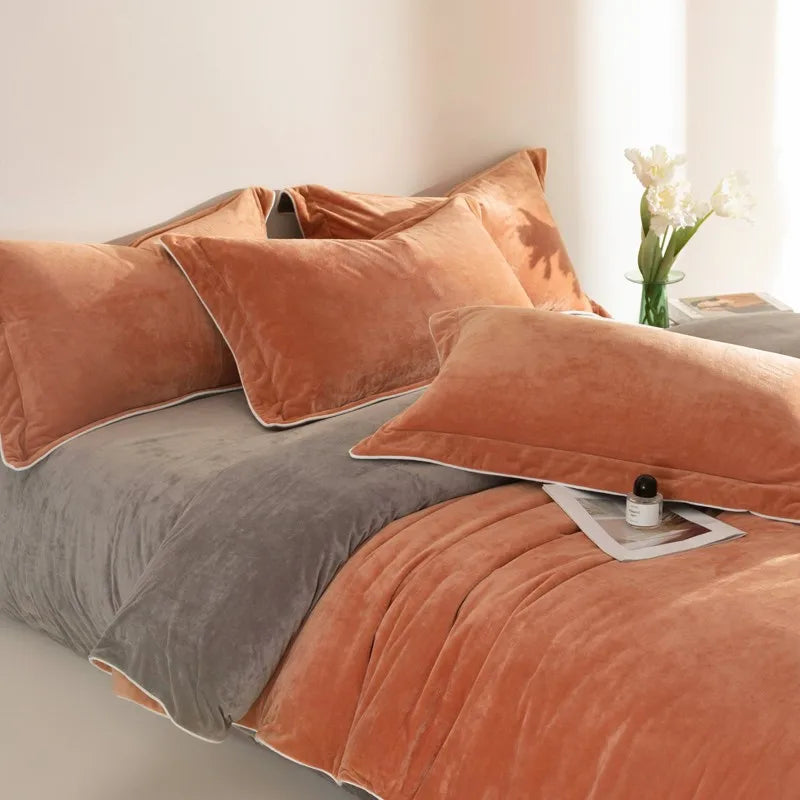 Flat and fitted sheets 500TC Reversible Fluffy Microfiber Duvet Cover Set with Sheets - Rust velvet bedding blanket in a bedroom setting. Bed with orange and gray bedding and pillows in a softly lit room.