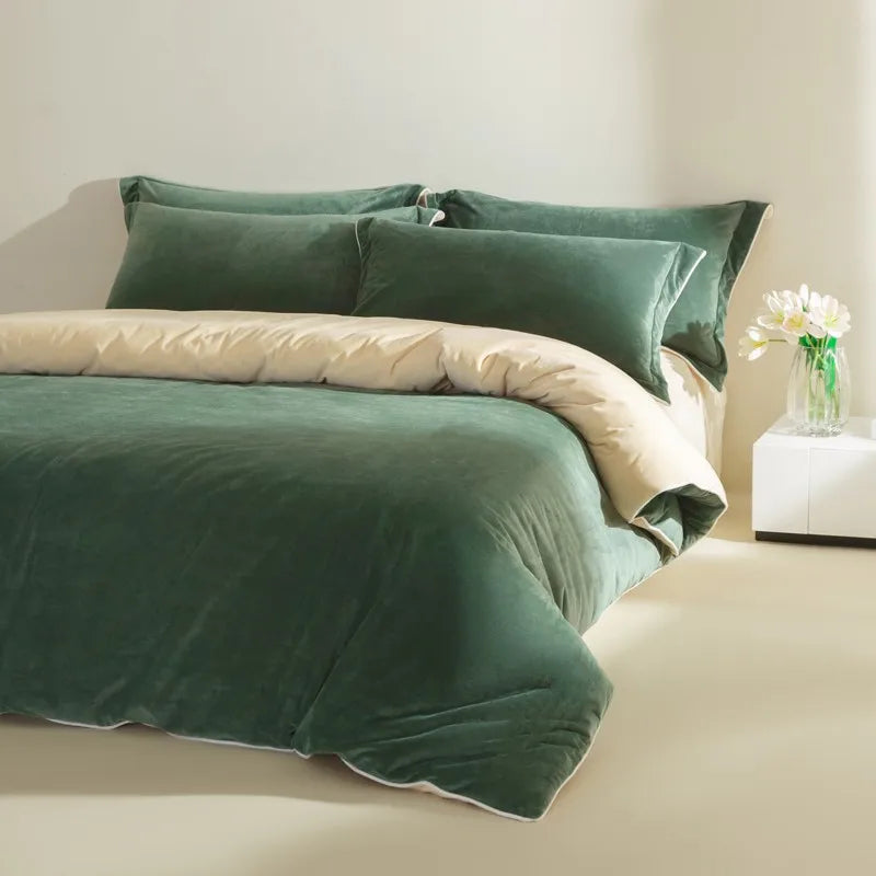 Green bedding set on a bed with a neutral background