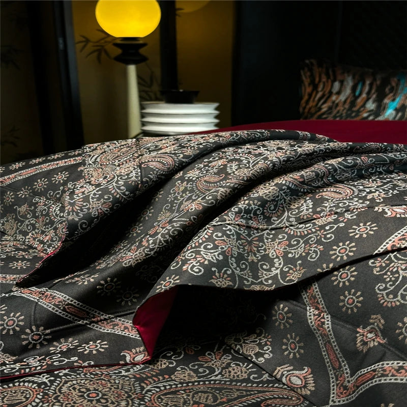 Patterned duvet cover on a bed with a blurred background