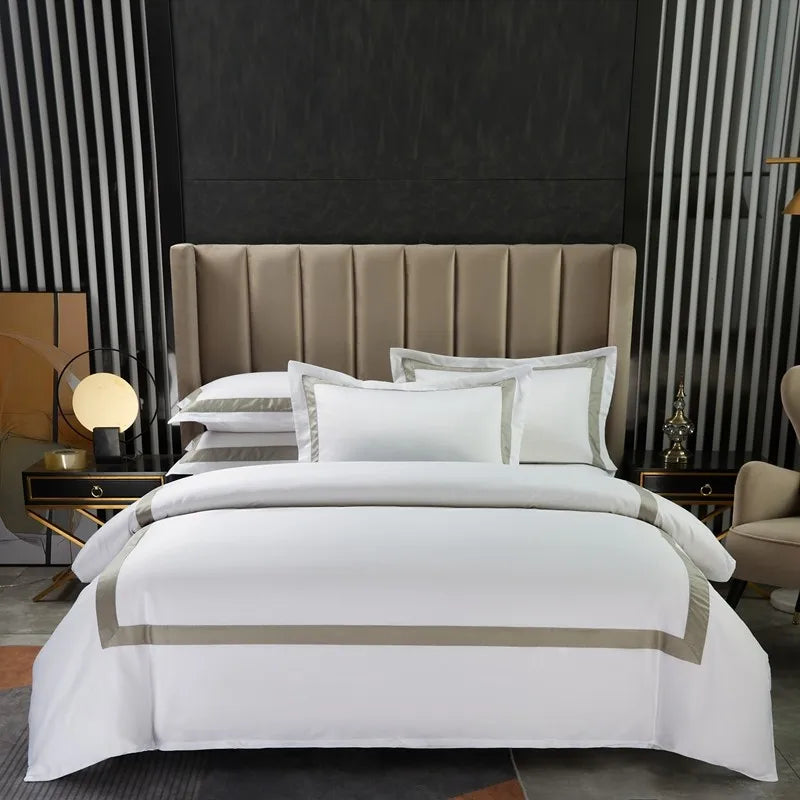 The Happy Ladies white hotel bedding set with duvet cover and pillowcases.