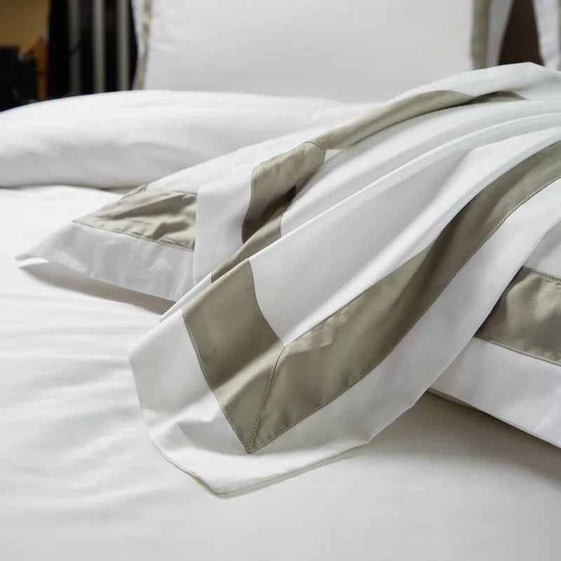 White duvet cover with gray stripes on a bed